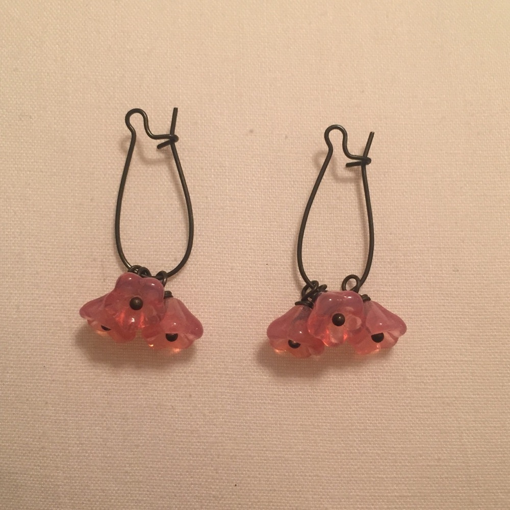 Bronze metal dangling earrings with pink flowers